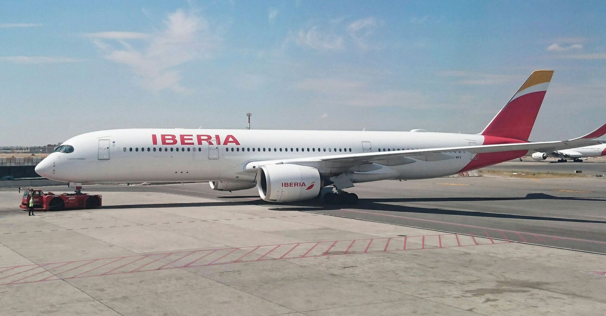 Iberia aircraft on the runway at Madrid Airport before departure