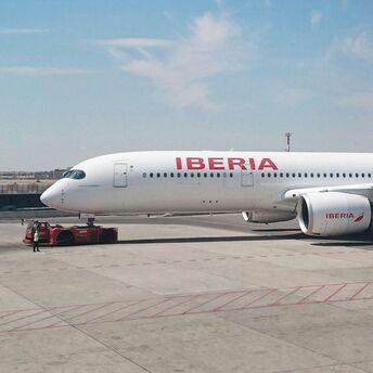 Iberia aircraft on the runway at Madrid Airport before departure