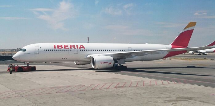 Iberia aircraft on the runway at Madrid Airport before departure