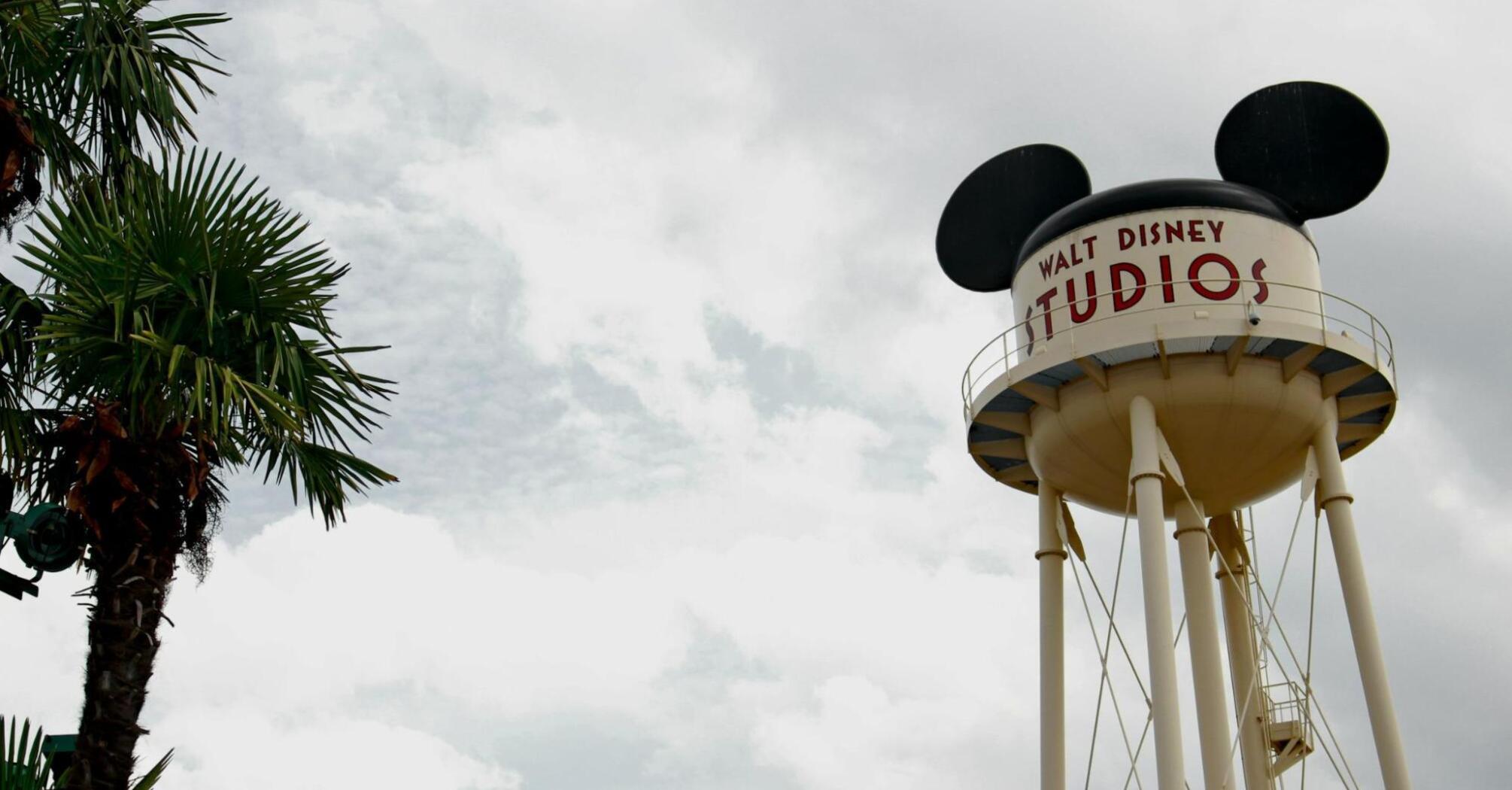 Walt Disney Studios water tower with Mickey Mouse ears under cloudy sky