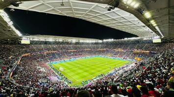 Crowded football stadium in Doha during a night match at one of Qatar’s major venues