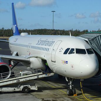 SAS aircraft boarding at a Scandinavian airport terminal