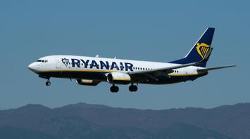 Ryanair aircraft approaching for landing against clear sky