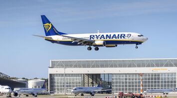 Ryanair aircraft approaching an airport runway on a clear day
