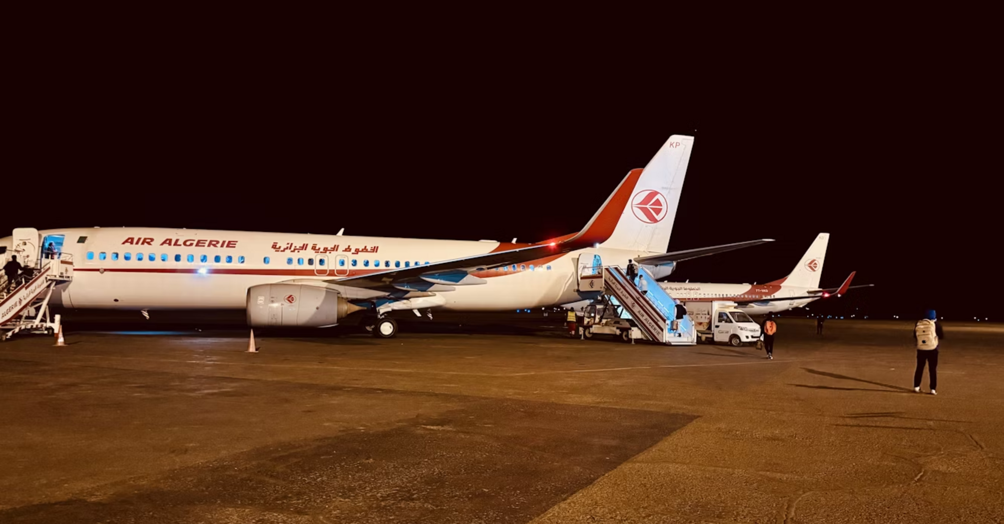 Air Algérie airplanes parked at night on the runway
