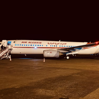 Air Algérie airplanes parked at night on the runway