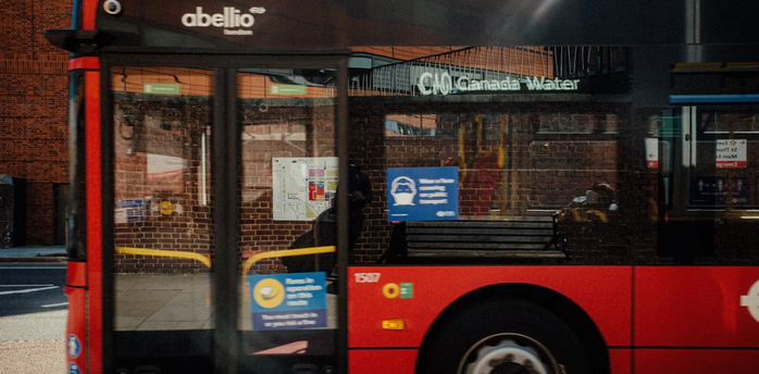 Red London bus on the C10 route near Canada Water