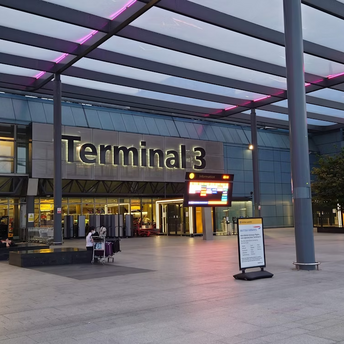 Exterior view of Terminal 3 at London Heathrow Airport in the evening