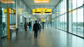 Passengers at Stuttgart Airport Terminal 1 near new Napcabs cabins