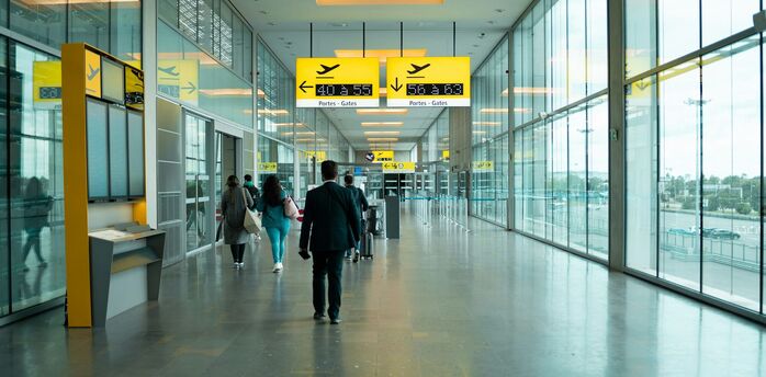 Passengers at Stuttgart Airport Terminal 1 near new Napcabs cabins