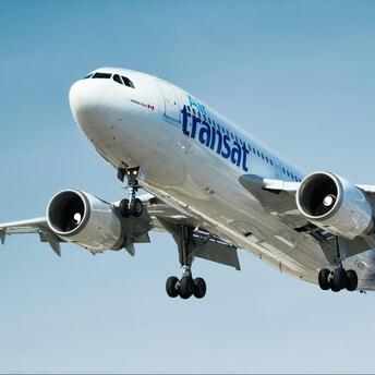 Air Transat Airbus aircraft taking off under clear skies