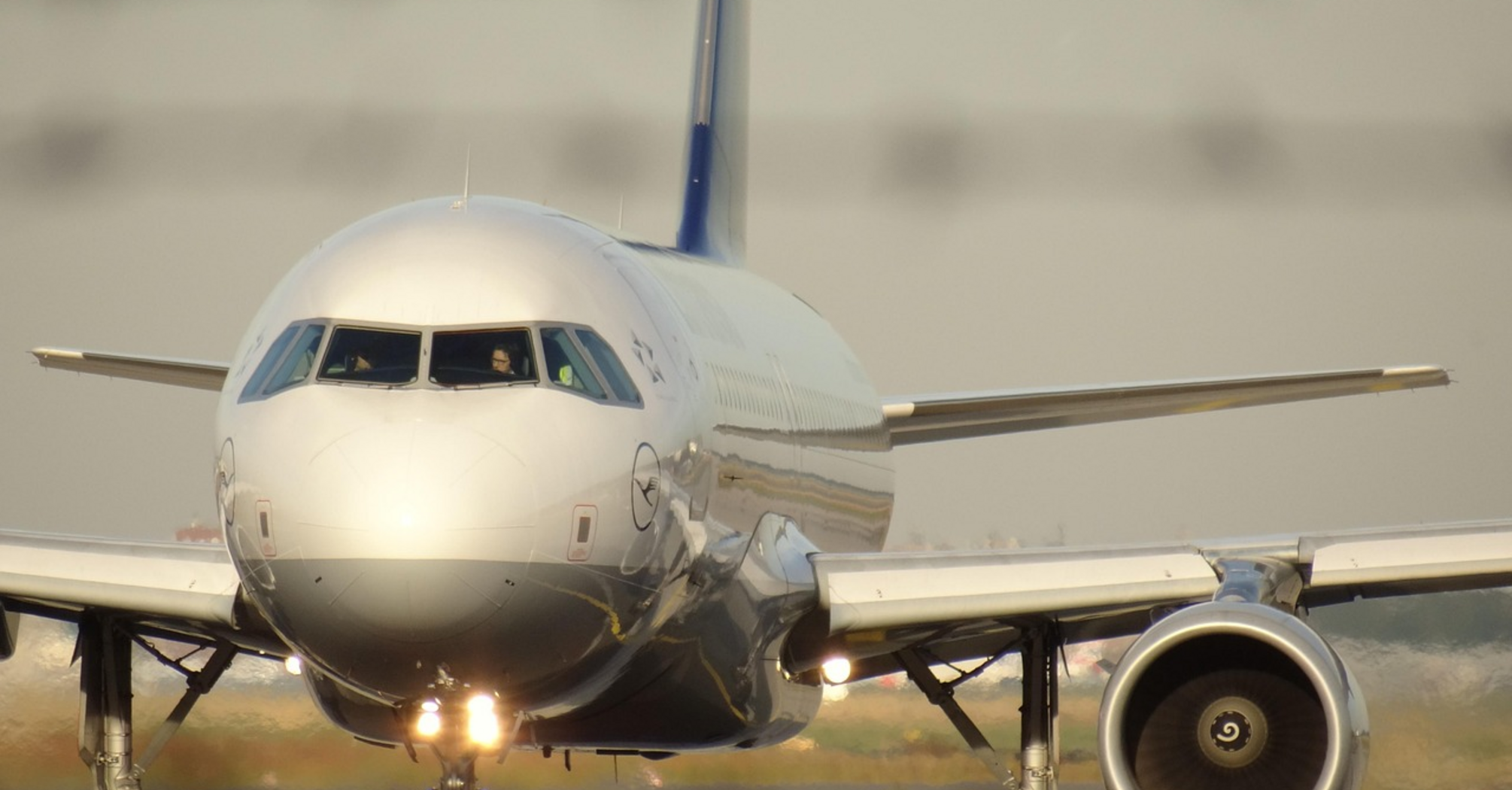 Front view of a Lufthansa aircraft taxiing on runway