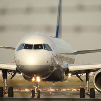 Front view of a Lufthansa aircraft taxiing on runway