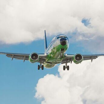 Plane flying on sustainable aviation fuel