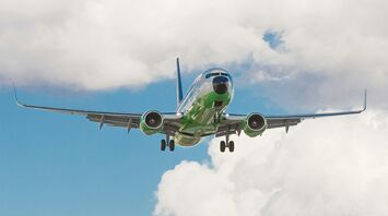Plane flying on sustainable aviation fuel