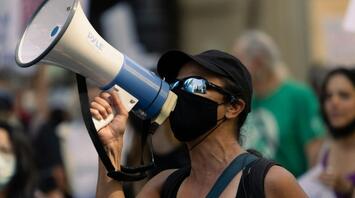 Protester with a megaphone during a public demonstration in Italy