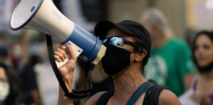 Protester with a megaphone during a public demonstration in Italy
