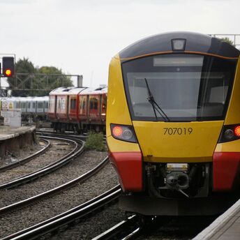 South Western Railway train arriving at a station platform