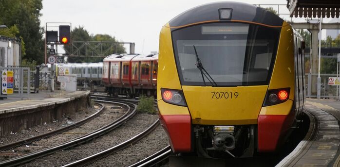 South Western Railway train arriving at a station platform