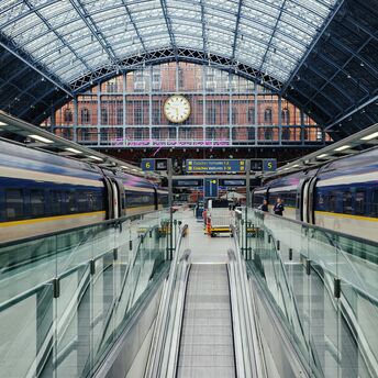 Eurostar trains at St Pancras International station under a glass roof
