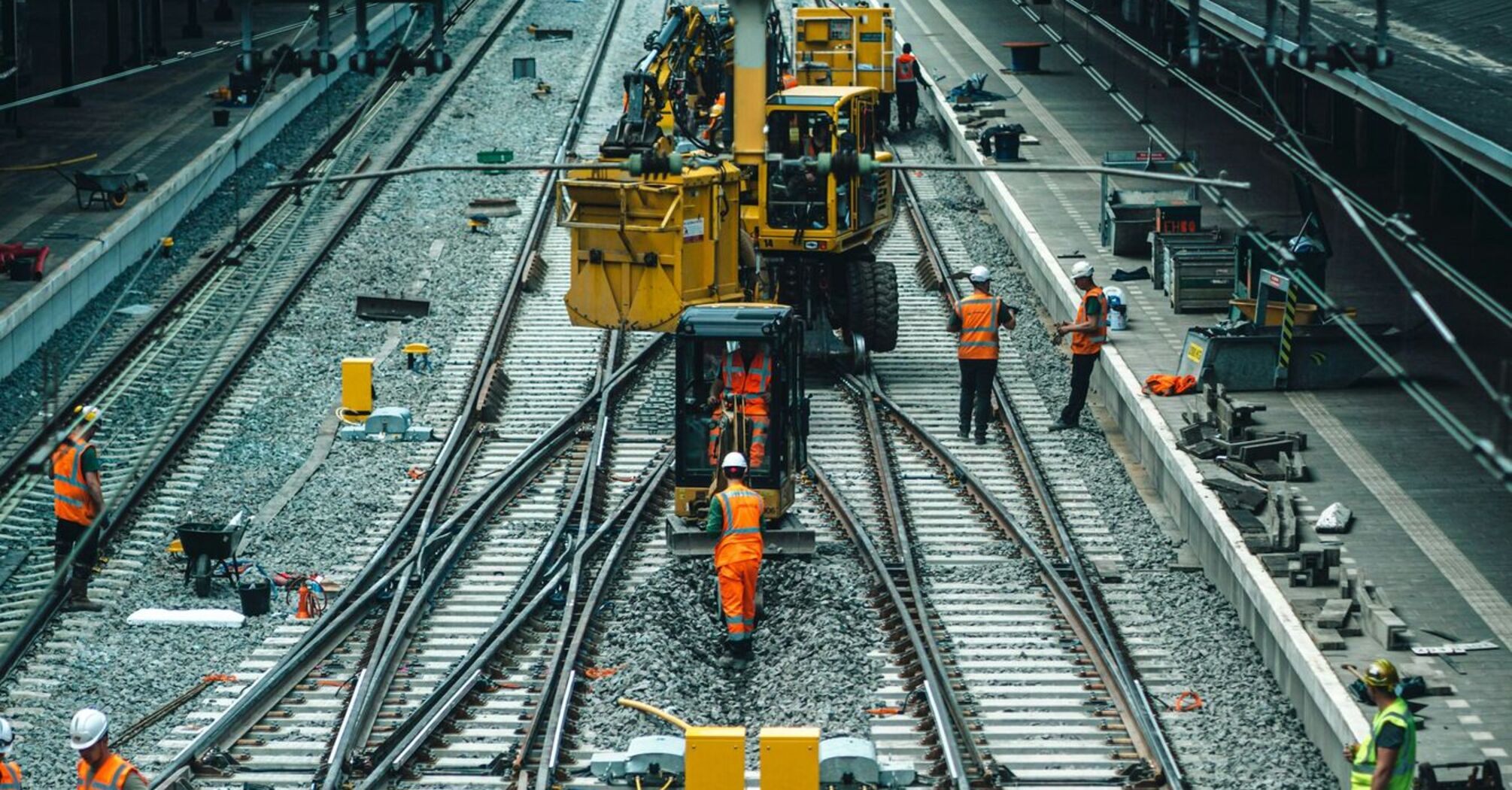 Railway maintenance workers repairing train tracks in northern Italy