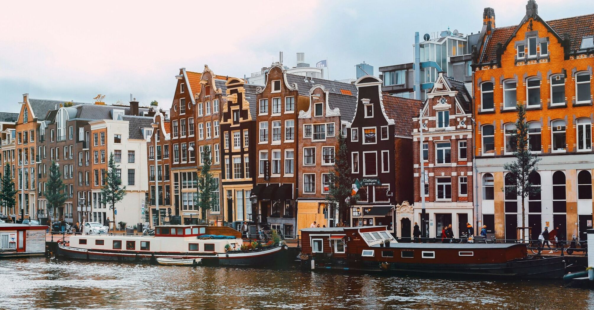 Traditional canal houses and houseboats in central Amsterdam