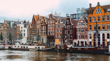 Traditional canal houses and houseboats in central Amsterdam