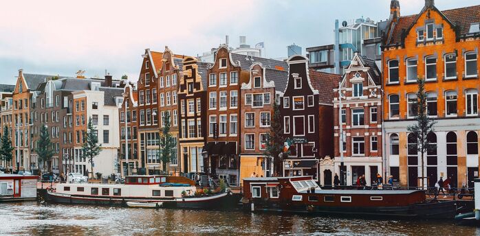 Traditional canal houses and houseboats in central Amsterdam