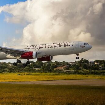 Virgin Atlantic aircraft landing at a Caribbean airport