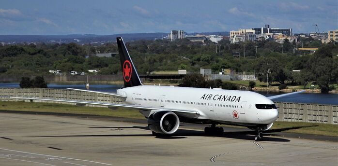 Air Canada aircraft taxiing at the airport before departure