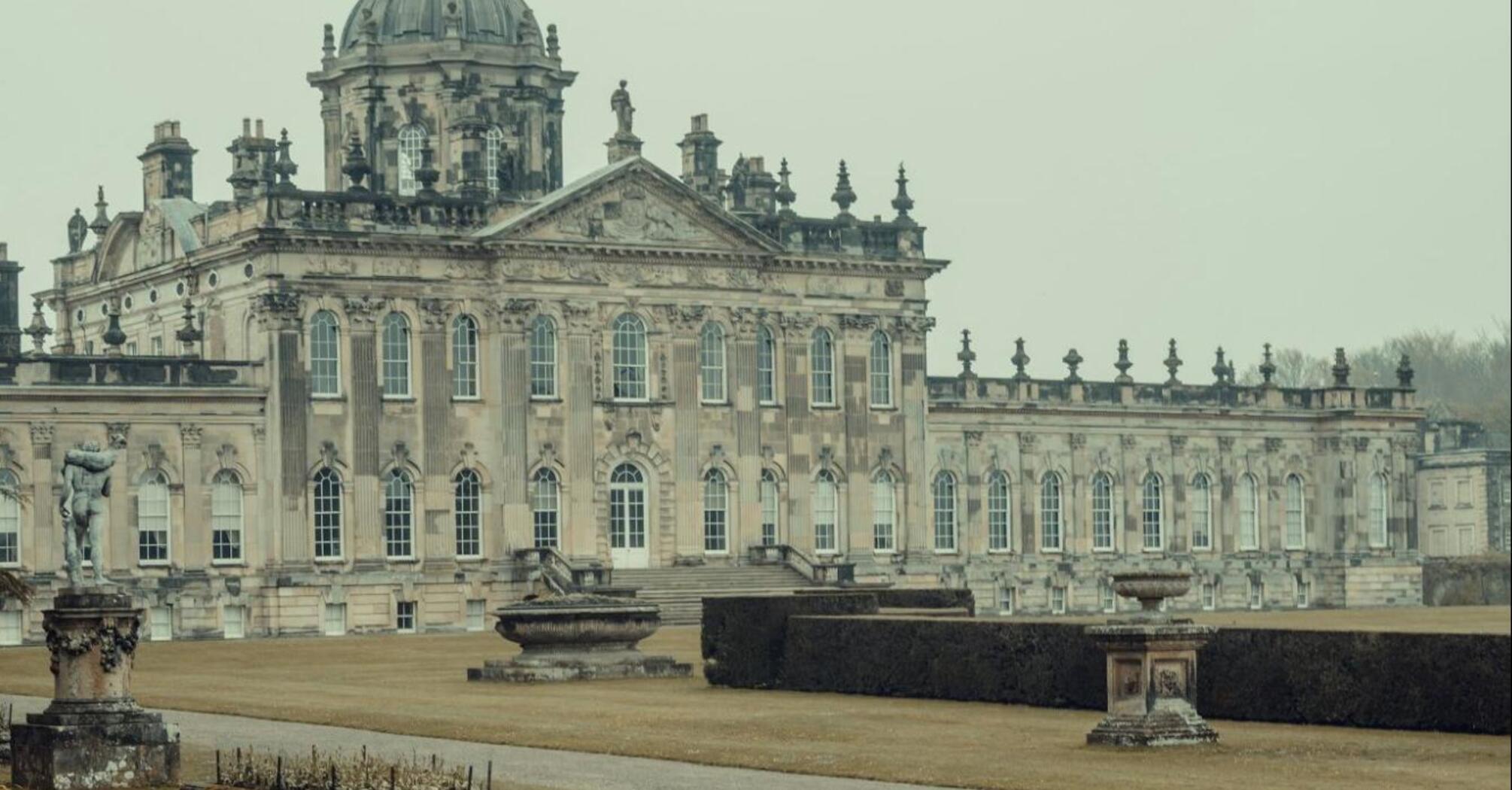Historic British estate with a peacock in the foreground