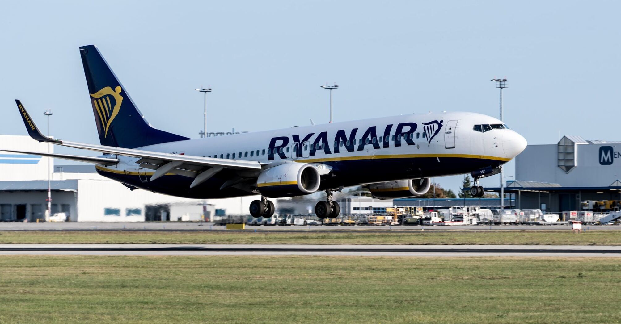 Ryanair aircraft touching down on the runway