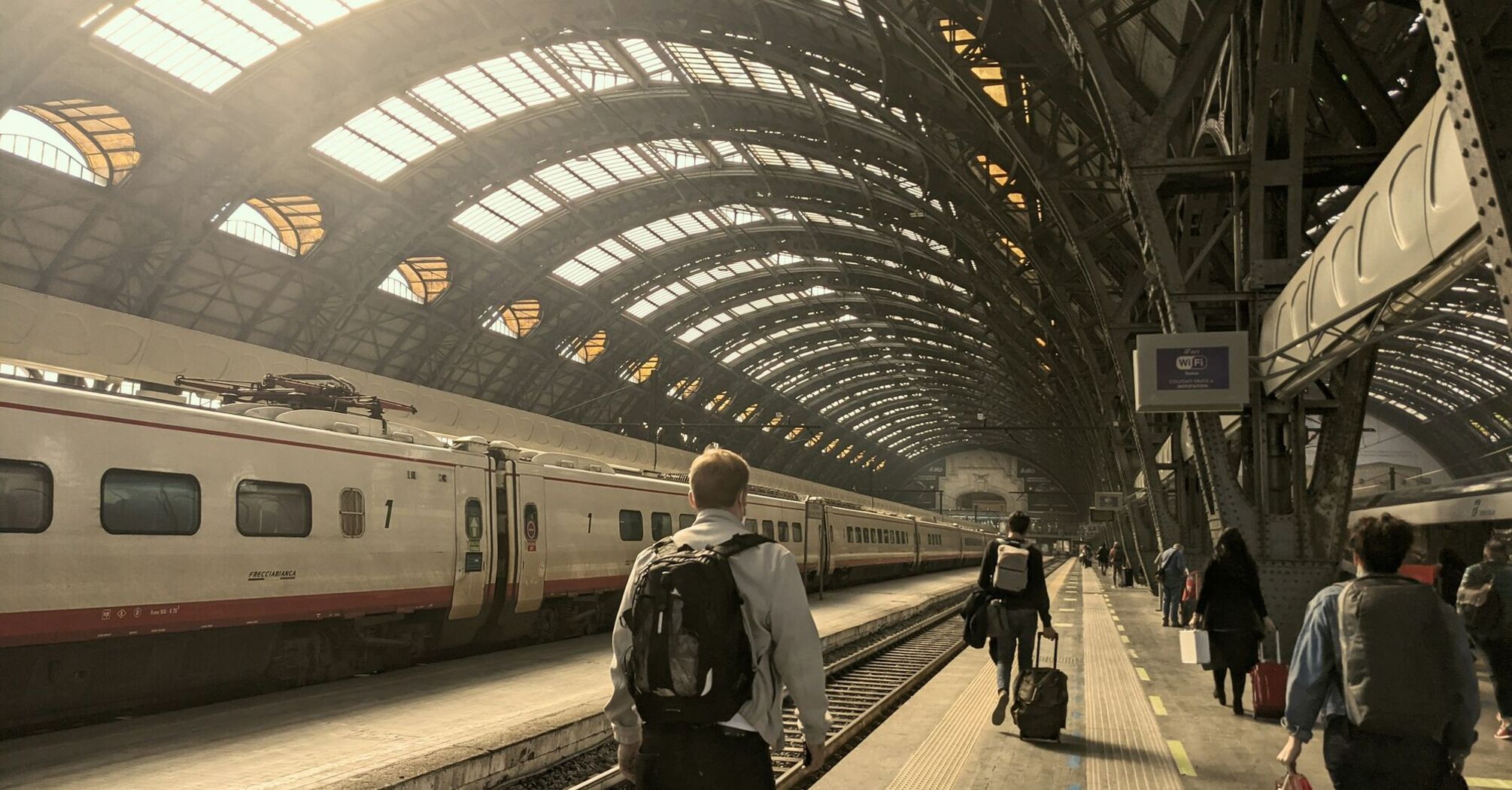 Passengers walking along a platform at Milan’s central station