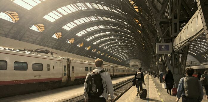 Passengers walking along a platform at Milan’s central station