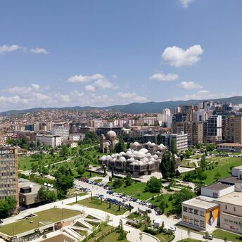 Aerial view of central Pristina with landmarks and residential areas