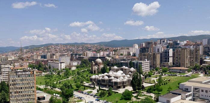 Aerial view of central Pristina with landmarks and residential areas
