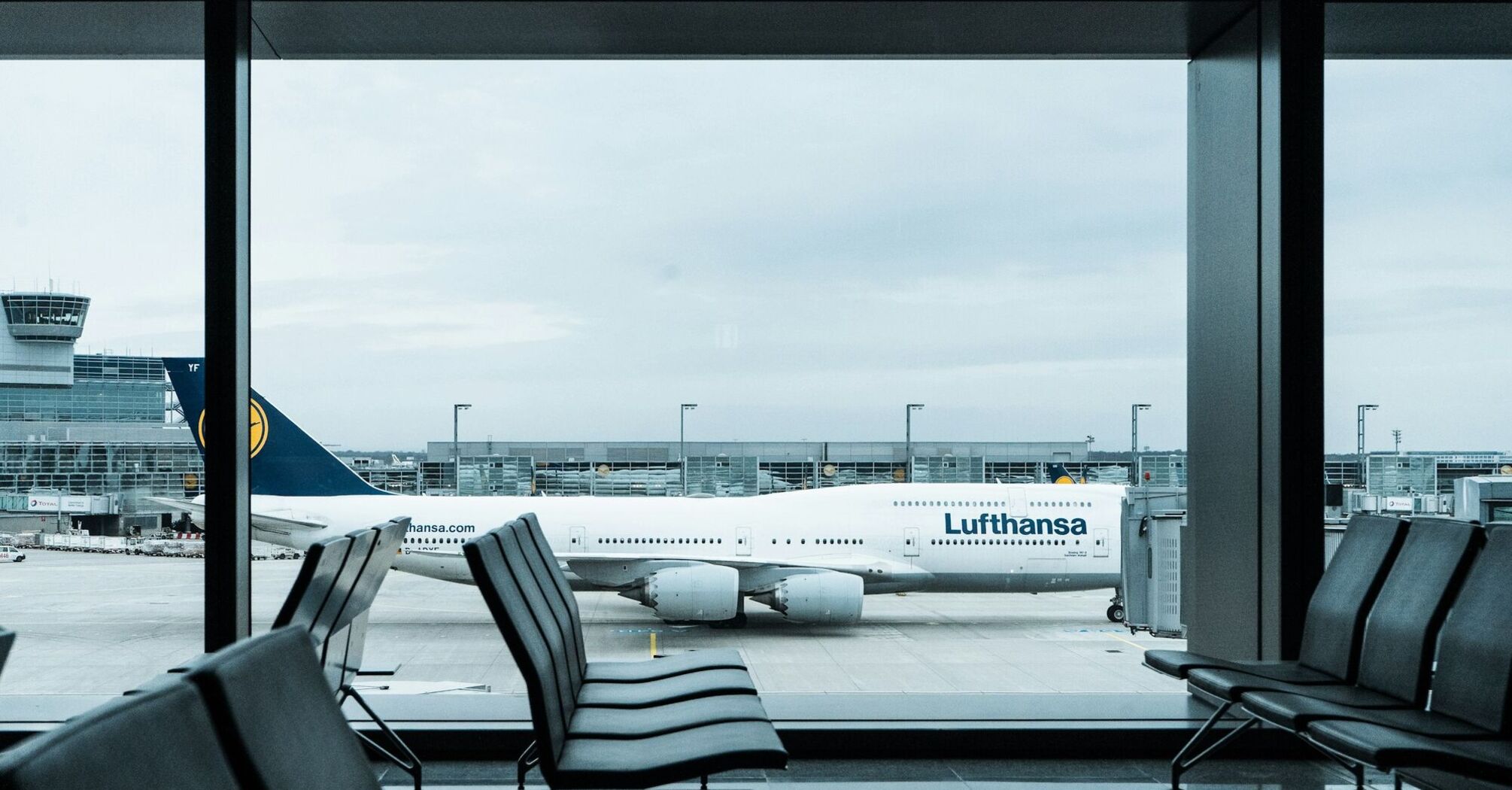 Lufthansa aircraft seen through airport terminal windows at Frankfurt