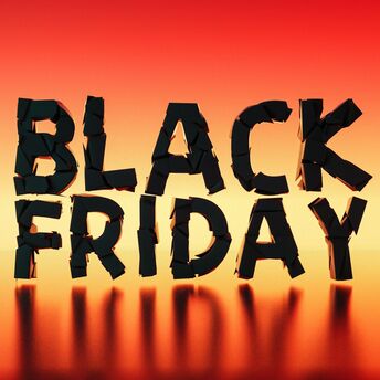 Black Friday travel deals graphic on a warm gradient background