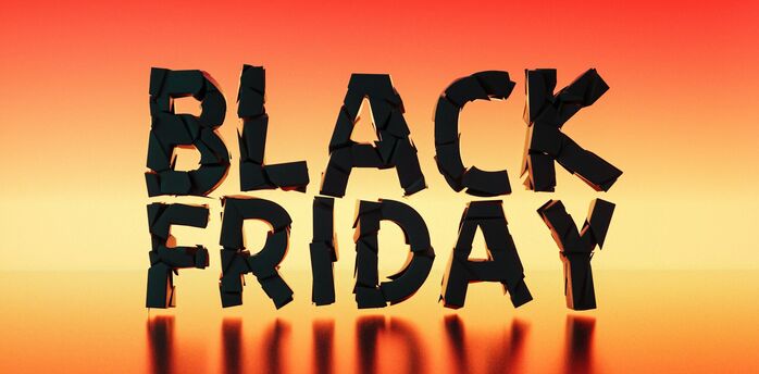 Black Friday travel deals graphic on a warm gradient background