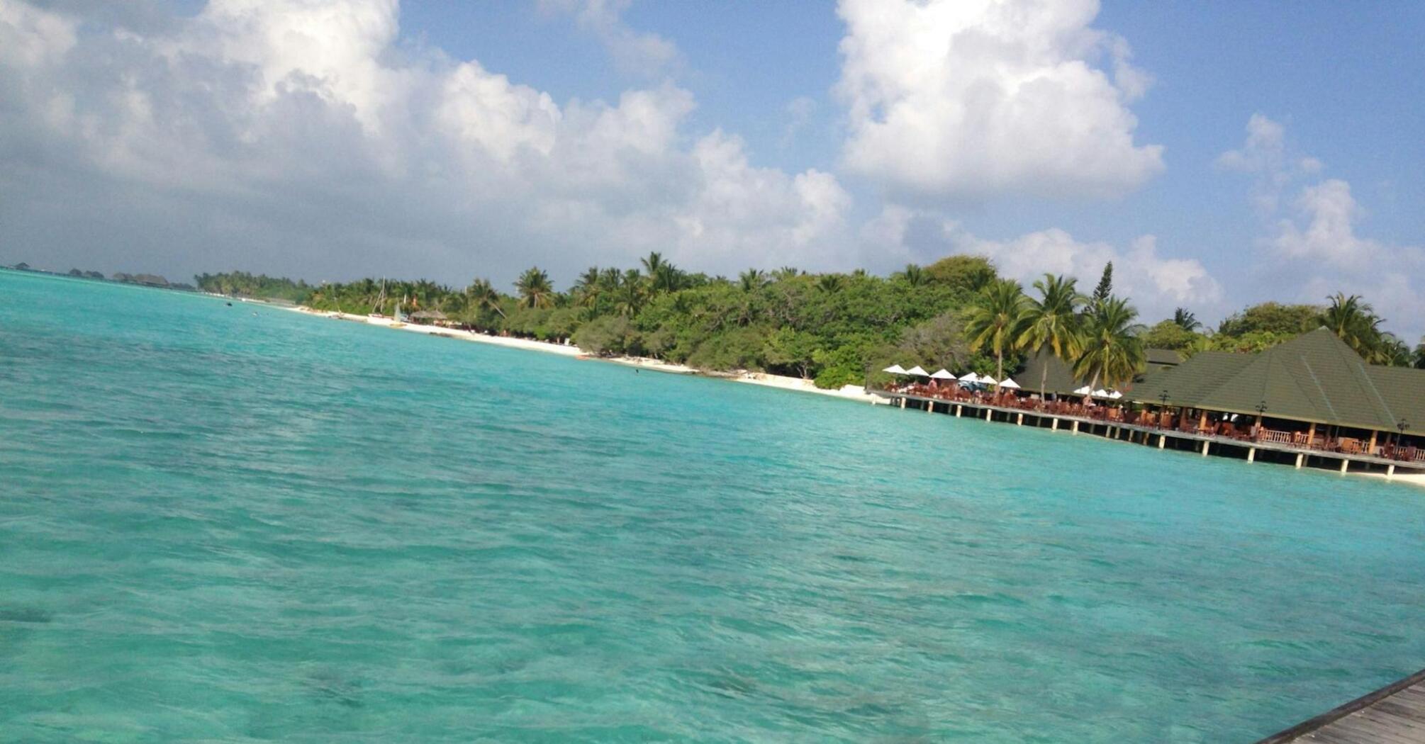 Turquoise waters and beachfront resort on a tropical island