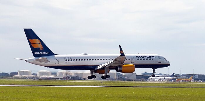Icelandair aircraft taking off from a runway under cloudy skies