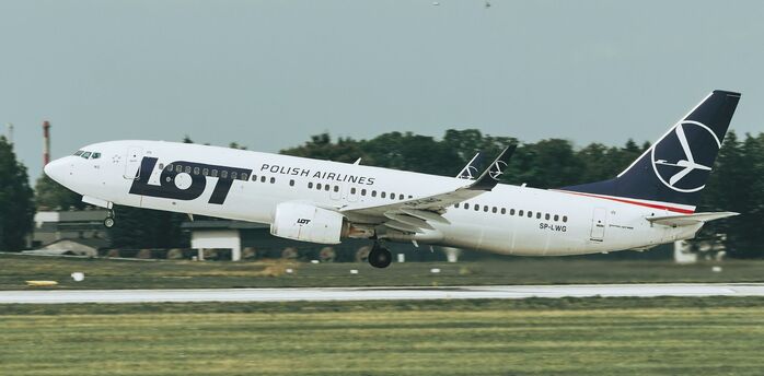 LOT Polish Airlines aircraft taking off from runway
