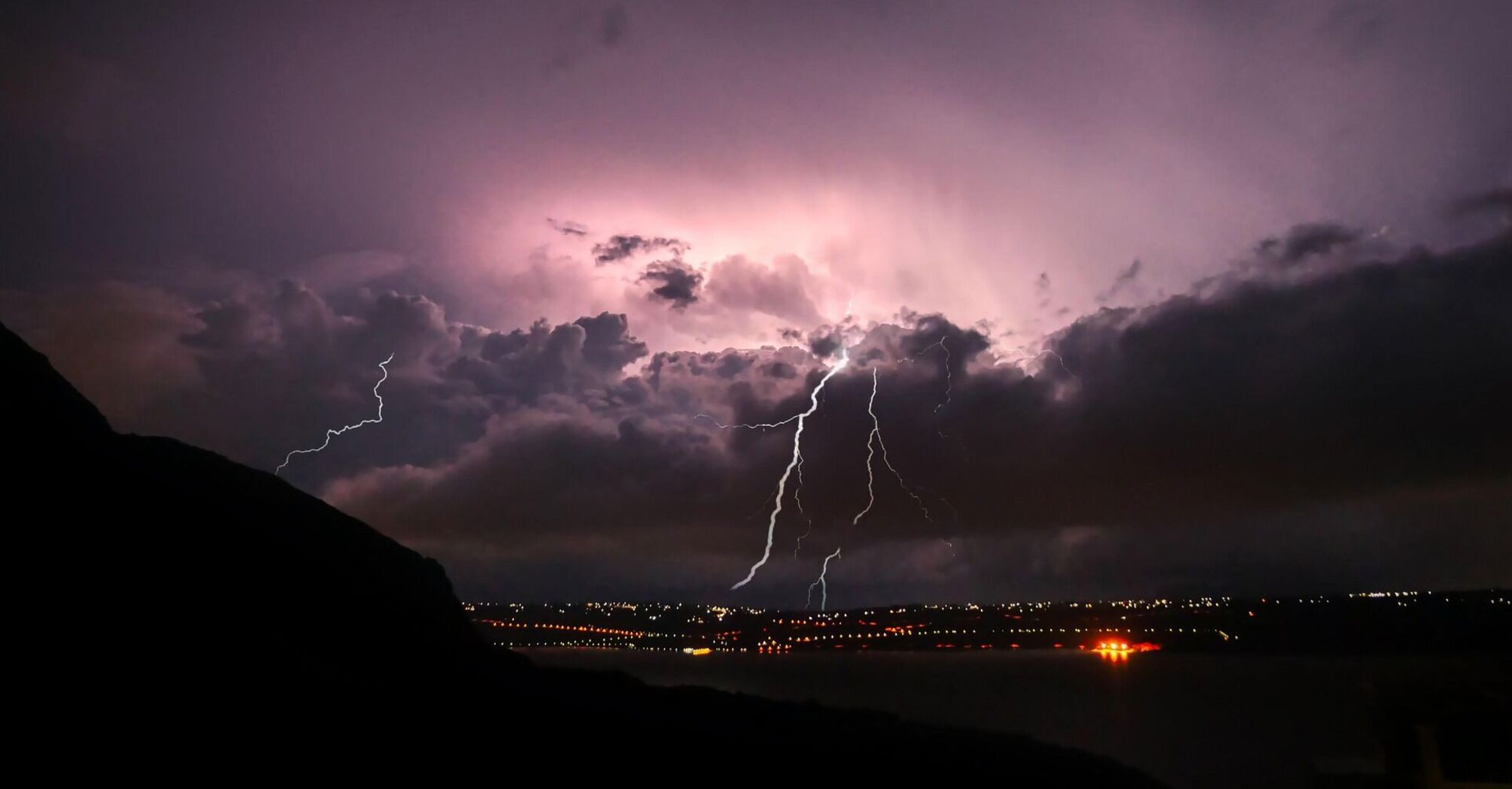 Lightning storm over Italian coast during night