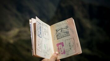 Open passport with multiple entry and exit stamps