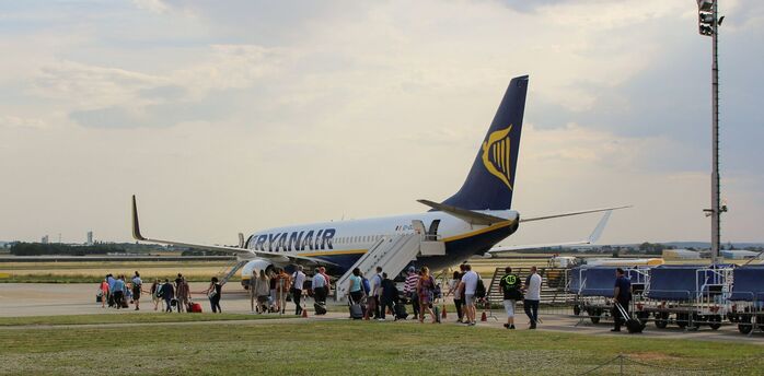 Passengers boarding a Ryanair aircraft on the tarmac