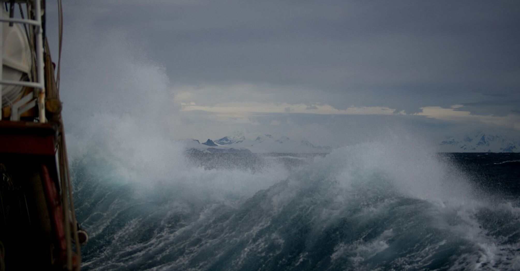 Large storm waves hitting a vessel during severe weather