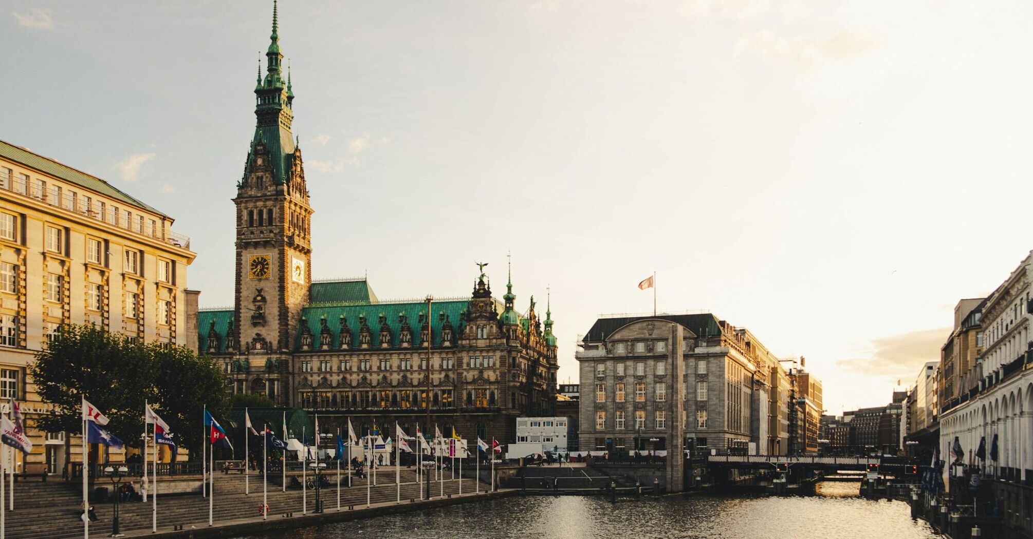 Hamburg city centre with the Rathaus overlooking the canal at sunset