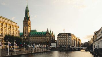 Hamburg city centre with the Rathaus overlooking the canal at sunset