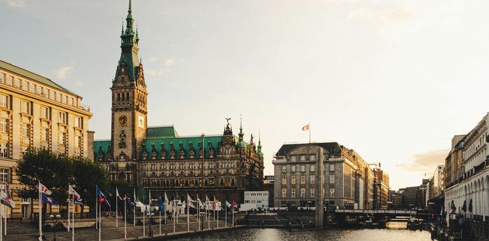 Hamburg city centre with the Rathaus overlooking the canal at sunset