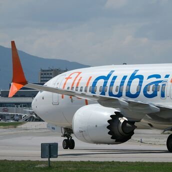flydubai aircraft parked on the apron during ground operations